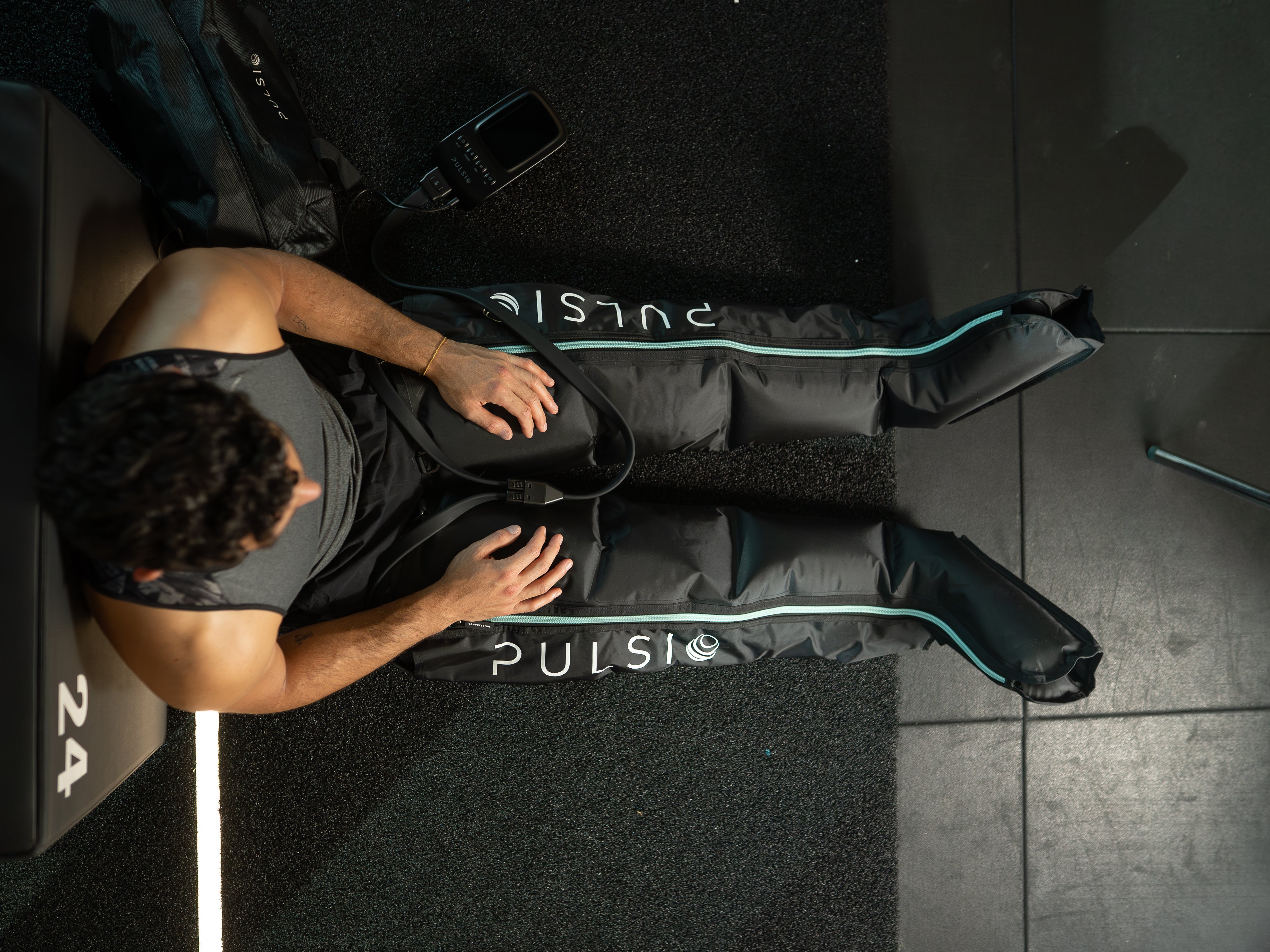 Leg compression sleeves with a massage gun, showing a £149.99 savings offer.