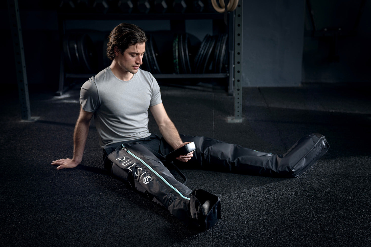 Leg compression sleeves with a massage gun, showing a £149.99 savings offer.