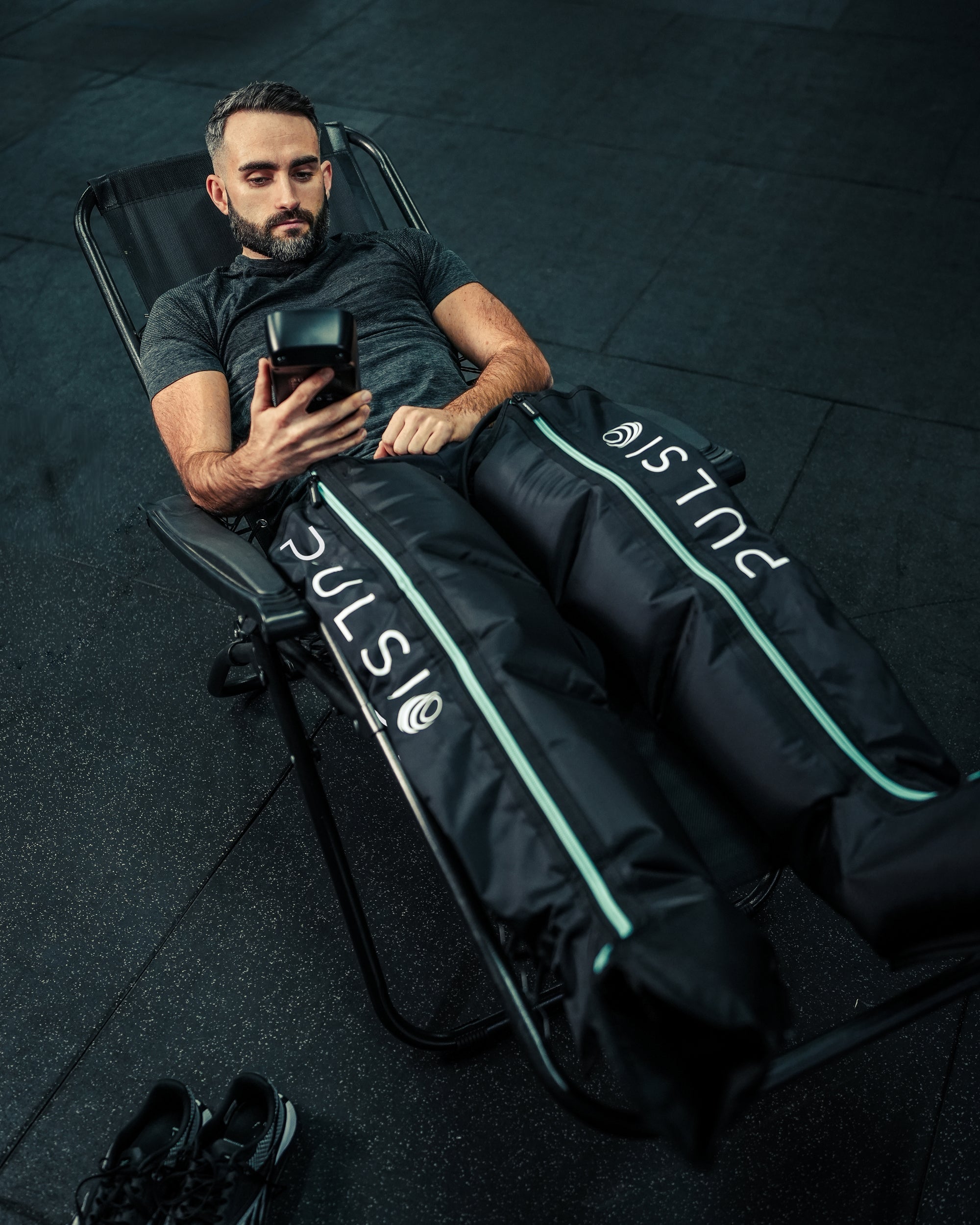 Leg compression sleeves with a massage gun, showing a £149.99 savings offer.